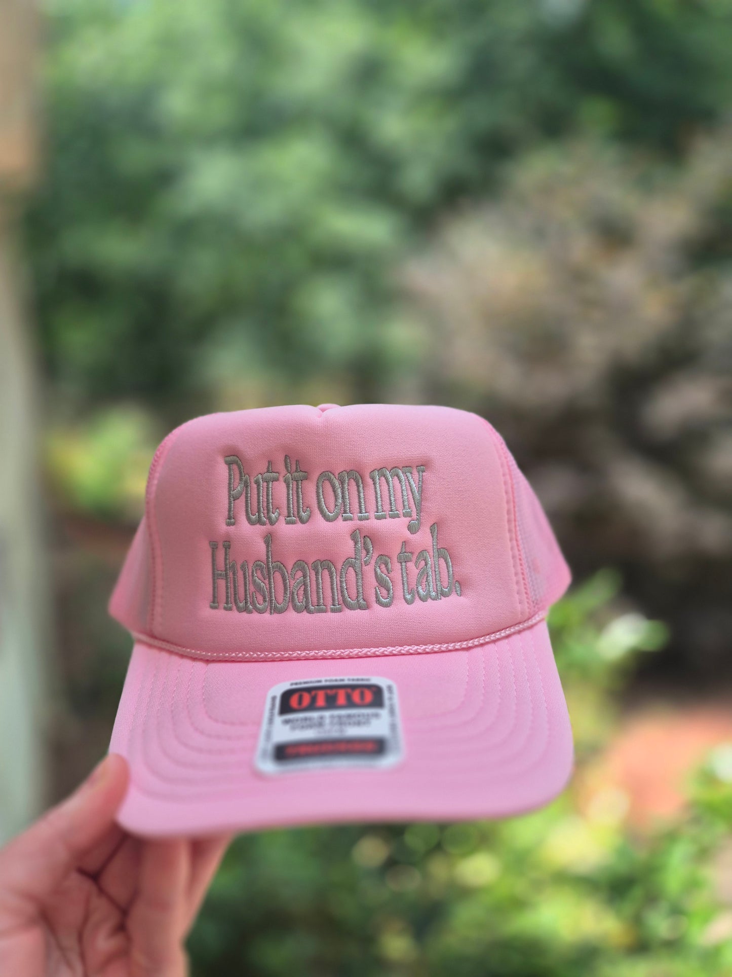 Put it on my husband's tab, trucker hat