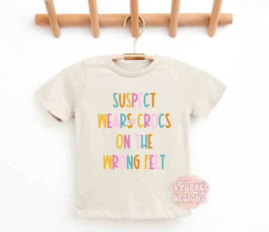 Suspect wears crocs on the wrong feet- toddler tee